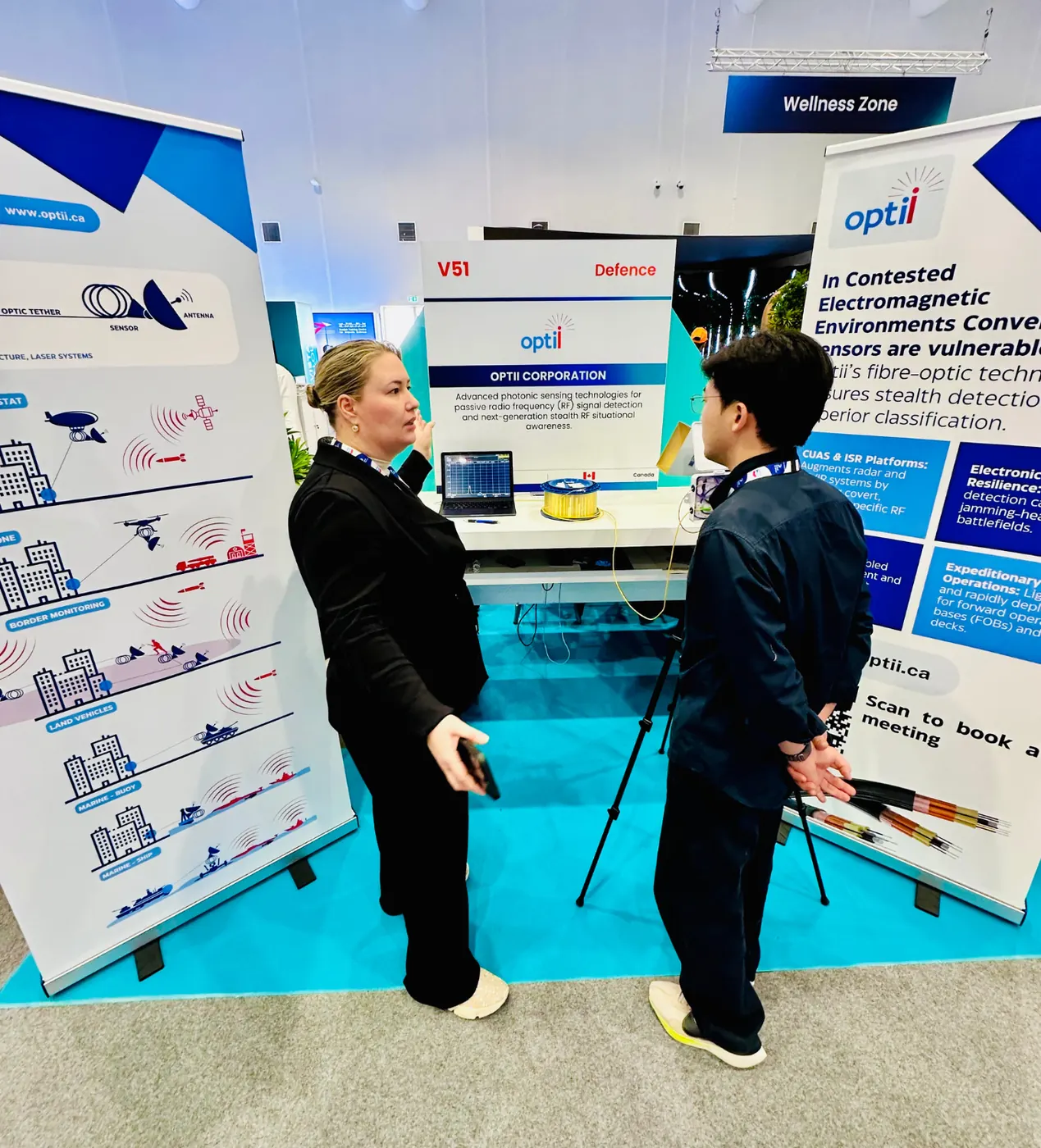 Optii booth conversation at Dubai Airshow.