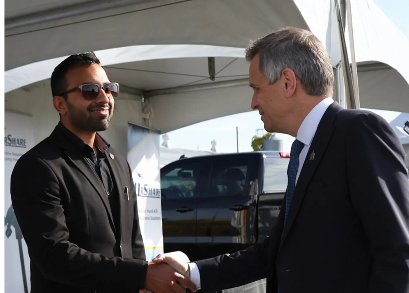 Daniyal Zafar speaking with Ottawa Mayor Mark Sutcliffe during outdoor demonstrations.